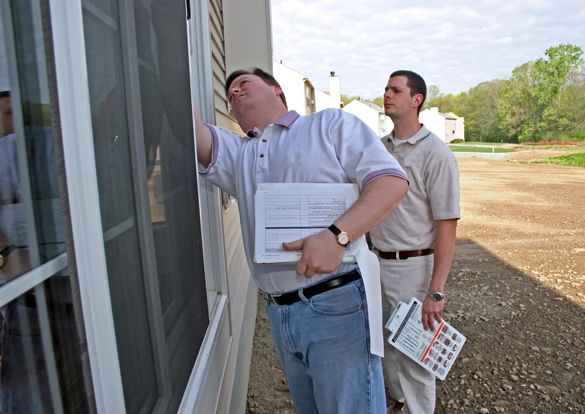 Home Inspector Checking Windows & Screens